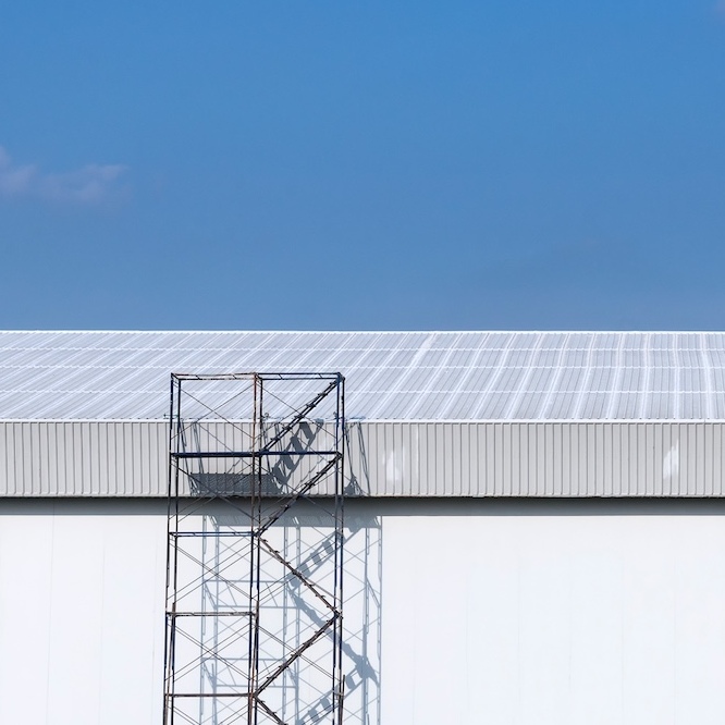 A flat grey metal roof